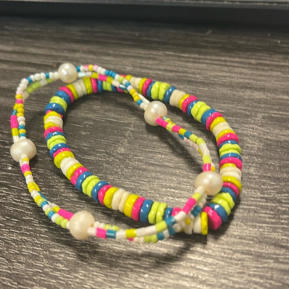 Neon multi color beaded bracelet set.